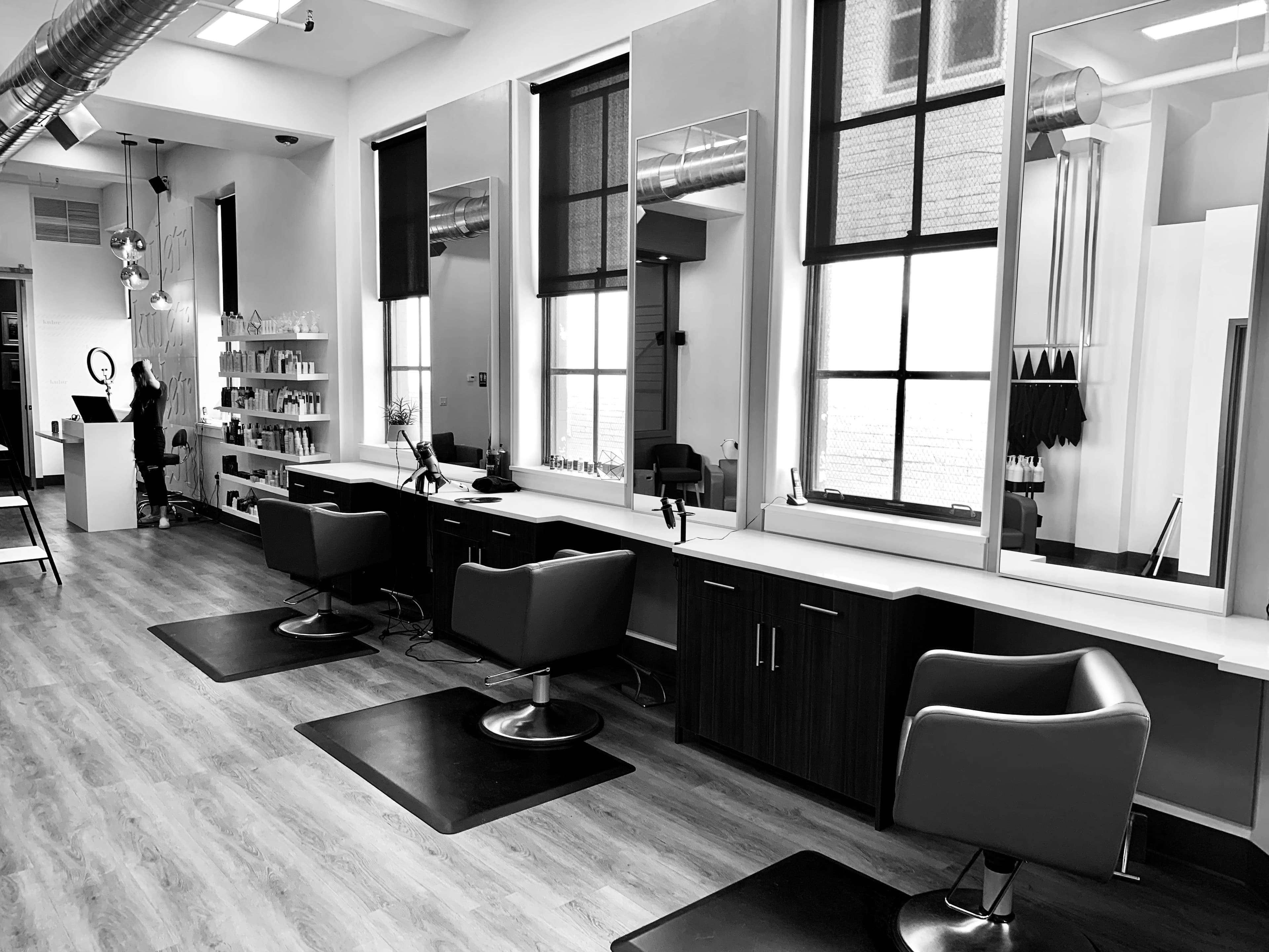 Professional beauty salon interior with elegant styling stations